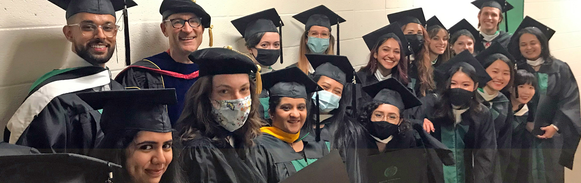 Group of students in academic regalia.