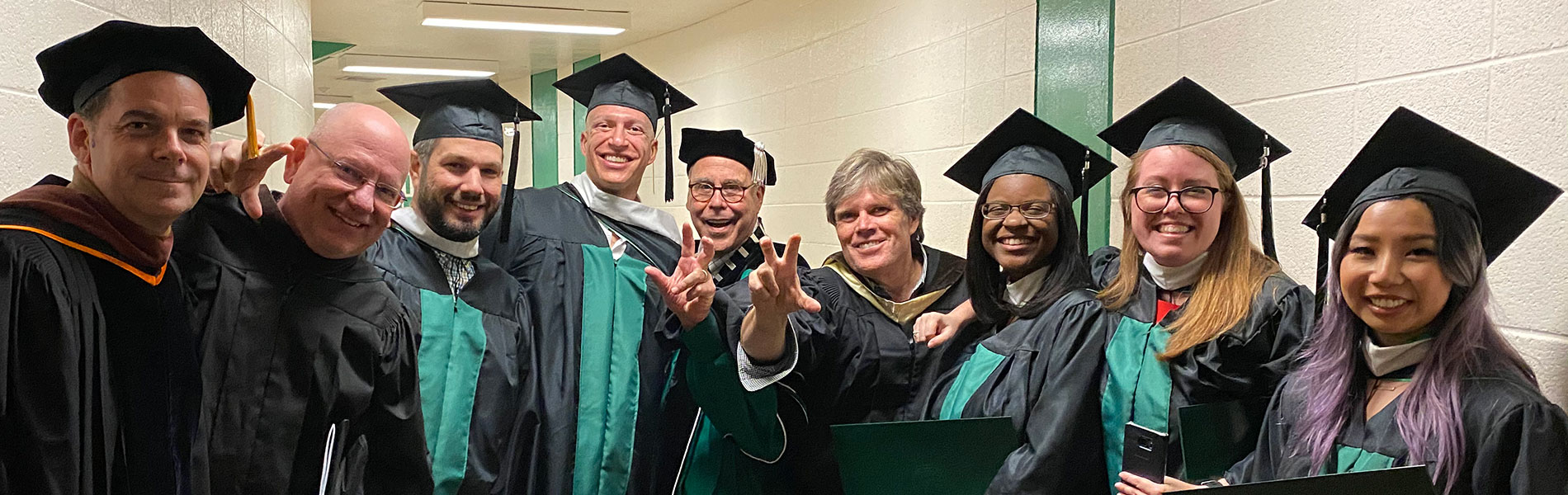 Students at commencement in academic regalia.