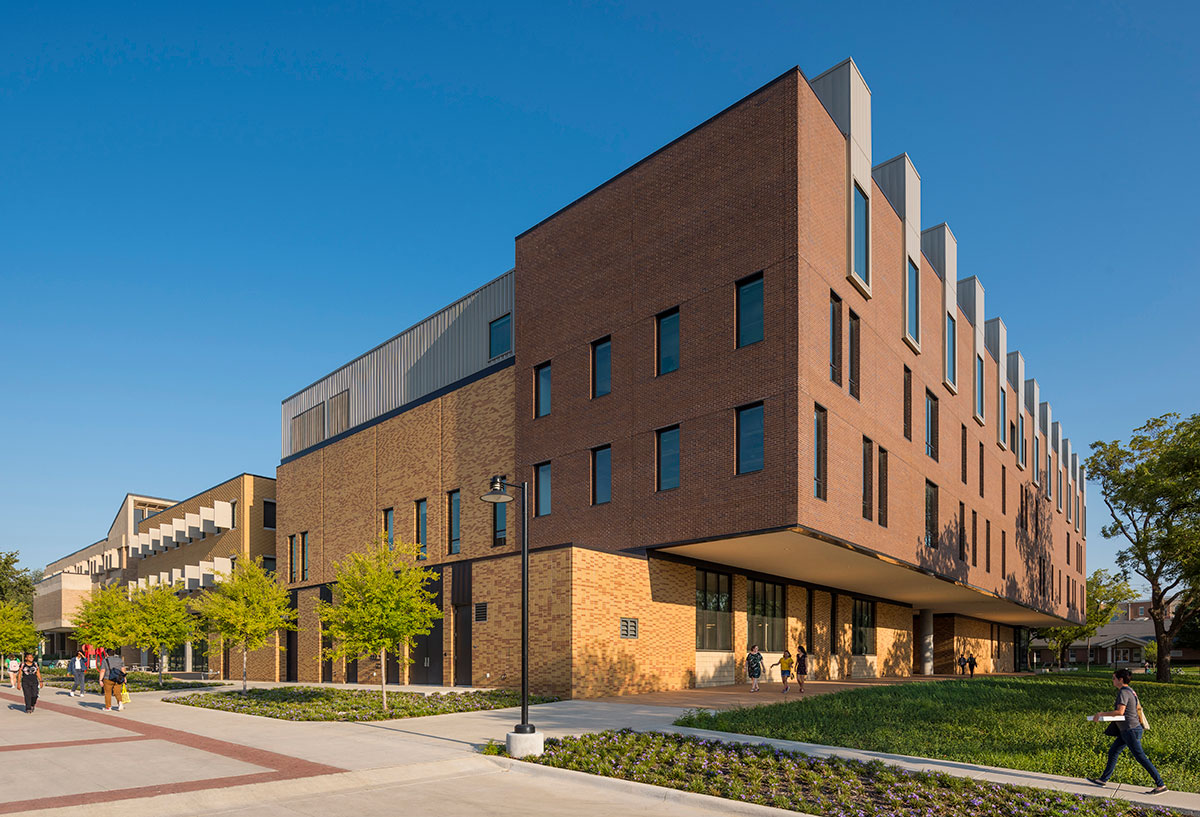 Large, four-story brick Art Building, sunny day, vivid blue sky