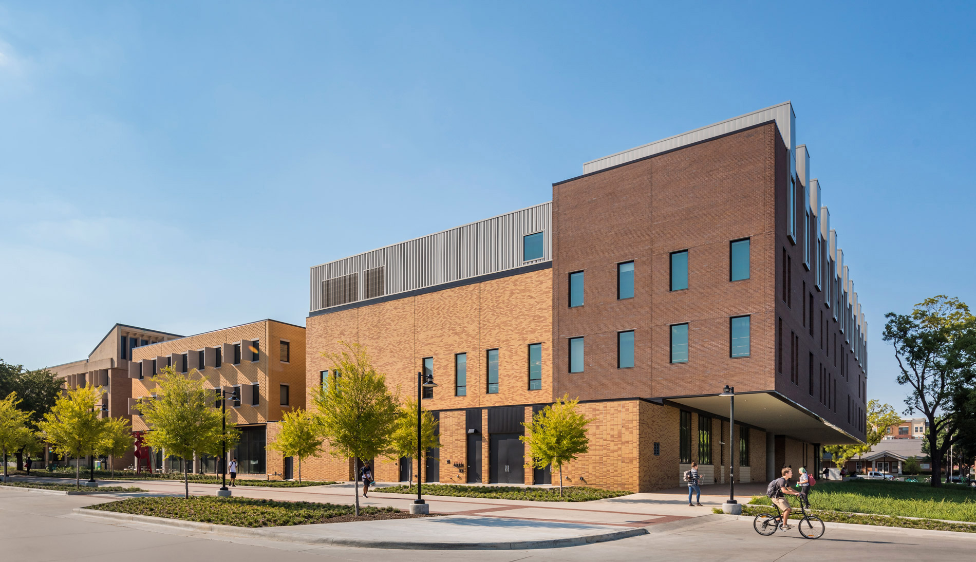 Southern facade of the UNT Art Building, brown bricks, four stories.