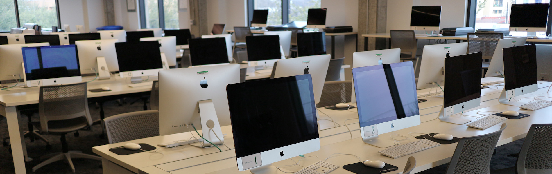 View of the SCL with rows of computers, tables and chairs.