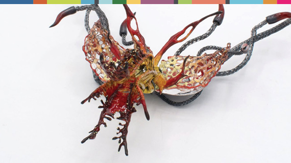A colorful carnivorous plant created with metal and ename.