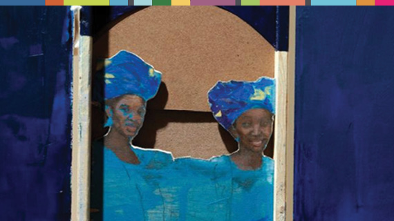 Two women wearing blue head scarves.