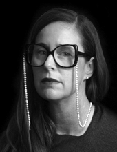 Denise Amy Baxter, black and white, head and shoulders, wearing glasses