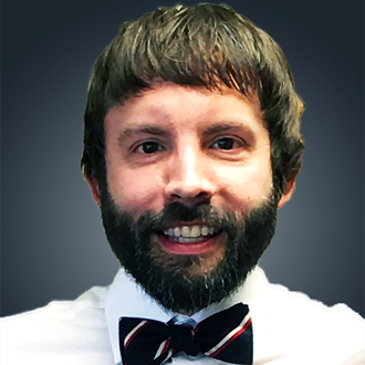 Jeremy Bernardoni facing forward, smiling, beard and mustache, wearing a bow tie