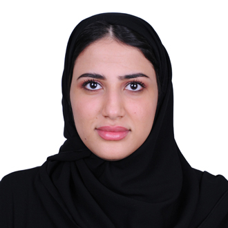 sahar wearing a black hijab, looking into the camera