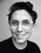 Liss LaFleur, black-and-white portrait, head and shoulders, short hair, wearing glasses