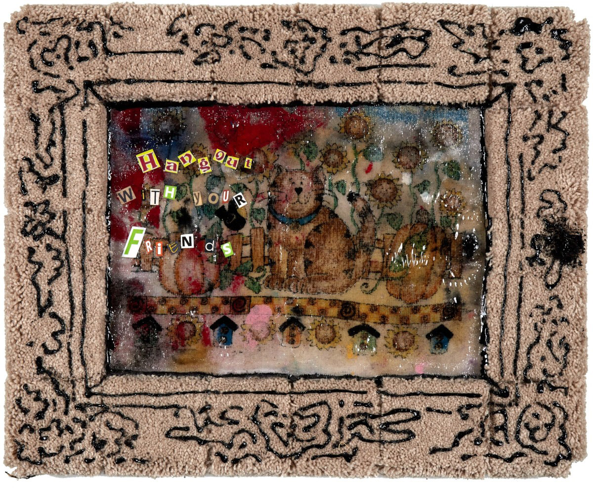 A piece of fabric with a cat covered in clear varnish and the text, ‘Hangout  with your friends,’ made with newspaper cuttings. Fabric is framed by beige carpeting covered in black acrylic paint drawn to resemble the pattern of a baroque picture frame. 