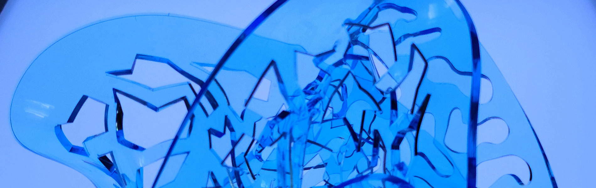 Sculpture exhibit — twisted blue acrylic called right brain, left brain together