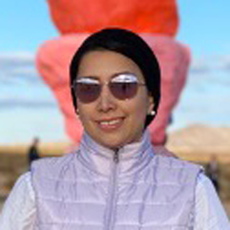 Leena facing forward, wearing sunglasses